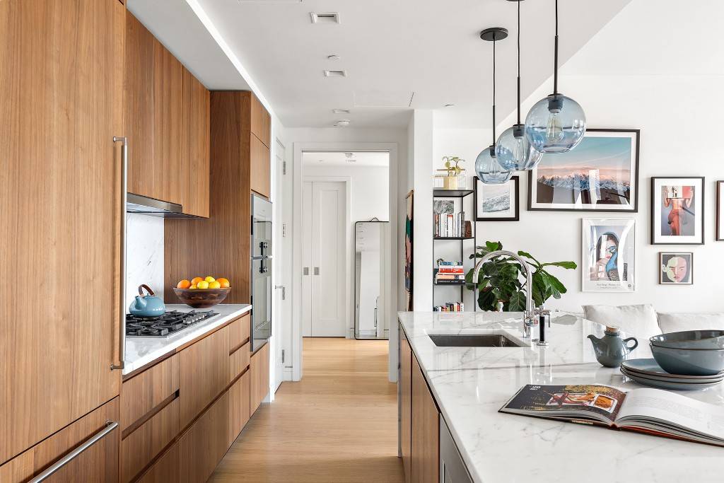 This spacious 1373 SF, two bedroom, two and a half bathroom residence features the SOUTH and EAST exposures, 10' ceilings and 7 wide plank white oak floors throughout and customized ...