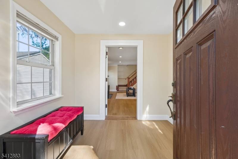 Charming four bedroom, three full bath Colonial perfectly blends timeless character with modern updates.