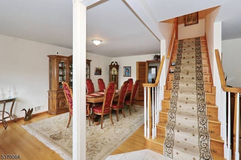 Welcome to this spacious center entrance colonial, ideally located near the heart of town.