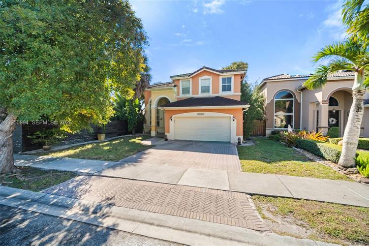 Spacious lakefront home located in Melrose Landing, a gated community with security, private roads, and a beautiful central lake.