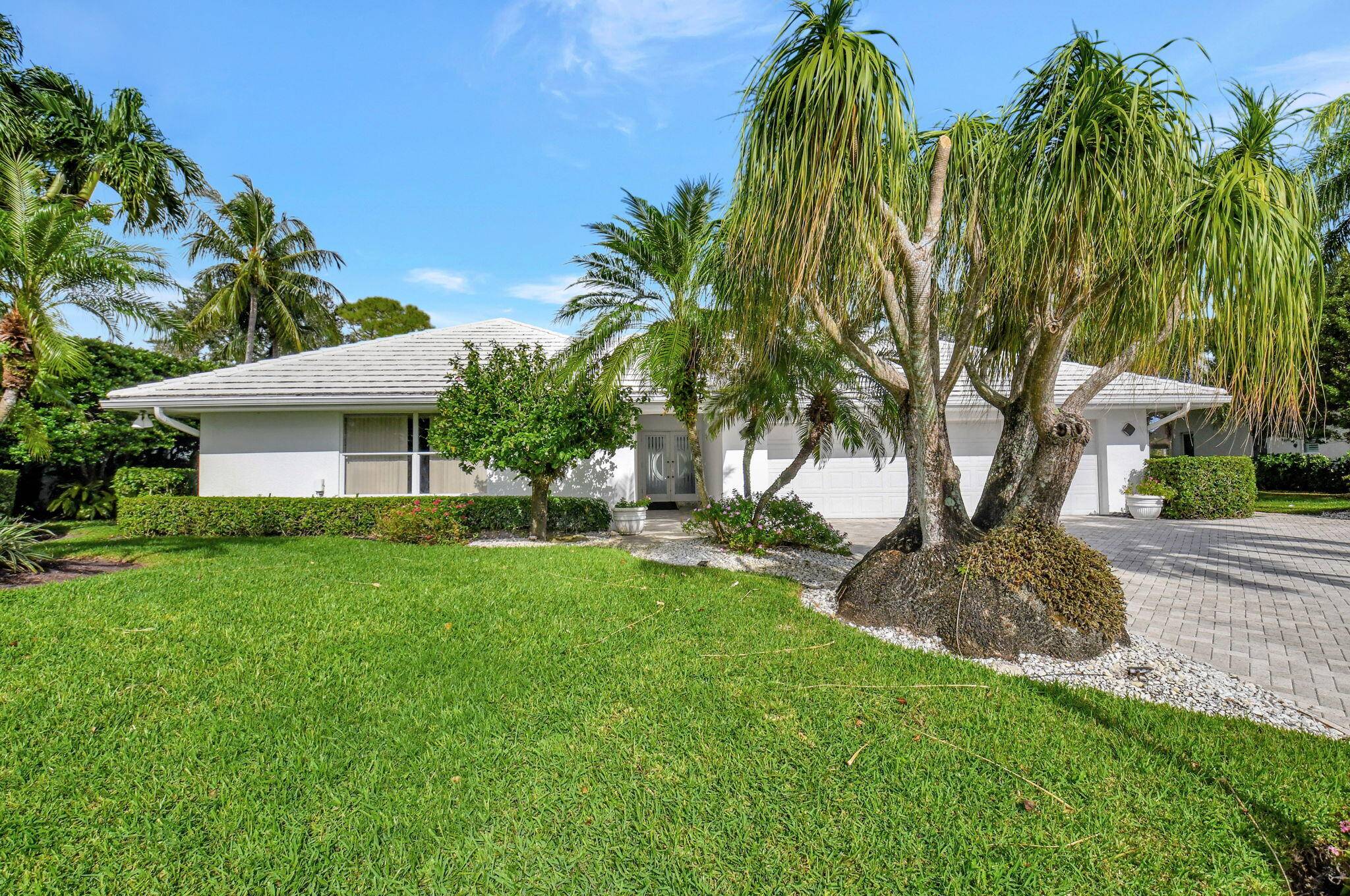 Welcome to this stunning luxury estate, nestled on over a third of an acre with breathtaking views of both the golf course and lake.