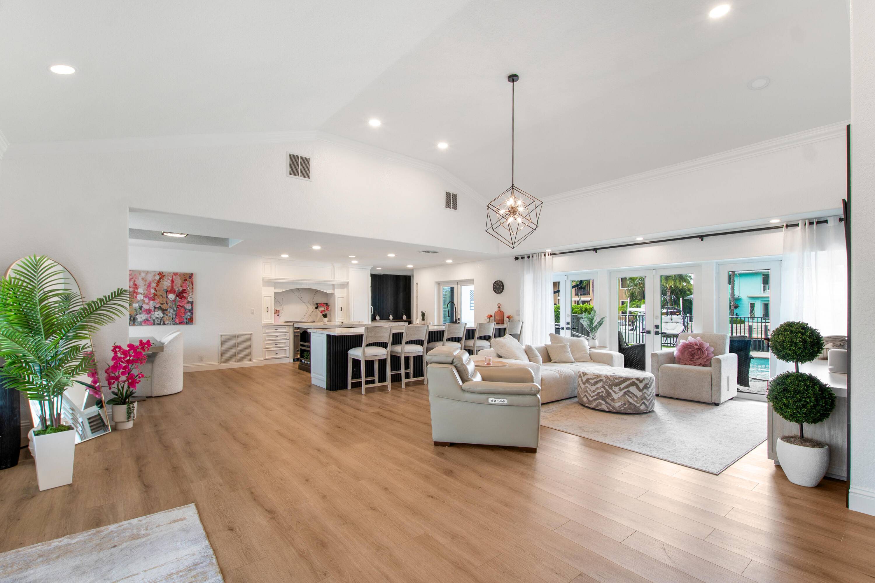 This beautifully redesigned estate in Venetian Isles offers 90 feet of waterfront and a private dock, ideal for those who desire the ultimate in coastal living.