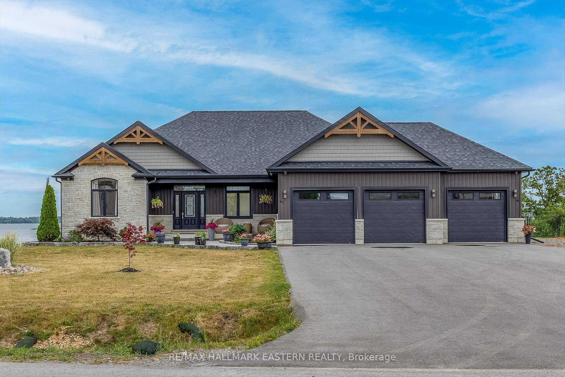 Step into lakeside living with this beautiful raised bungalow on a 1.