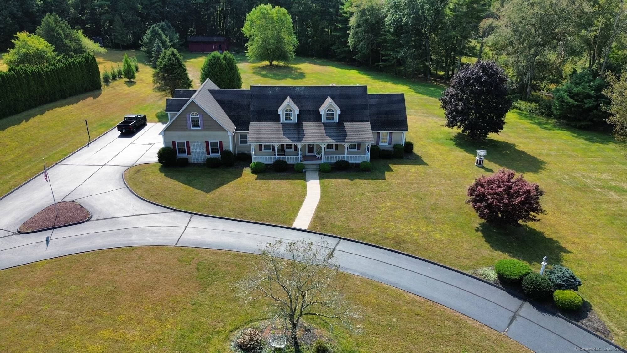 Welcome to 133 Munyan Road in Putnam, Connecticut a beautifully maintained and private retreat nestled on over 4 acres of picturesque land.