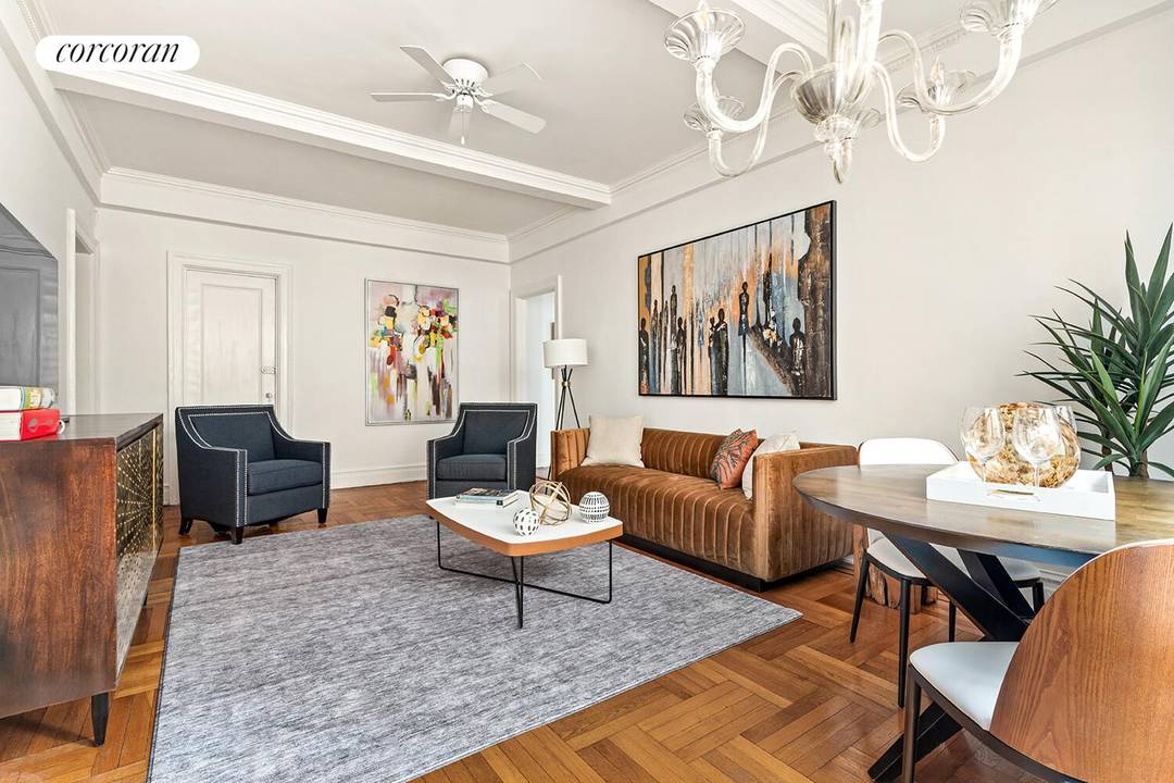 This beautifully renovated home exhibits the grandeur of oversized rooms with high ceilings in a classic pre war, full service building designed by famed architect Rosario Candela.