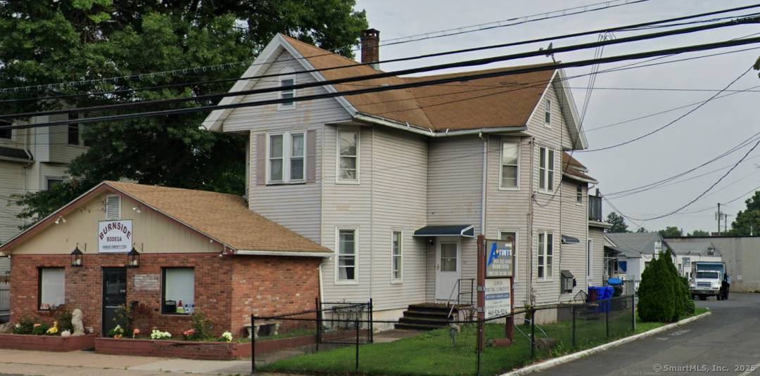 Great Street Presence, Convenient Location Turn this into your Store Front and workshop 2 family house in front with store front separate single family and 5 bay garage and a ...