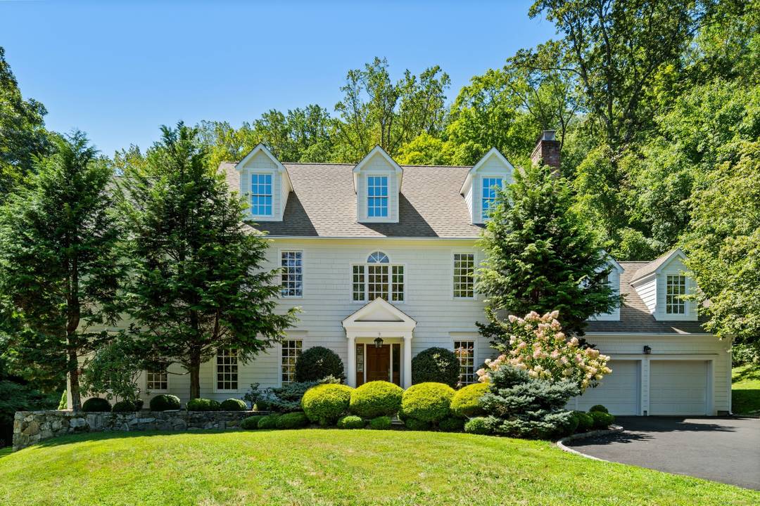 Welcome to 38 Davis Hill Road, Weston a beautifully appointed Colonial residence set on just over 2 private acres with meticulously landscaped gardens, mature plantings, and multiple patios.