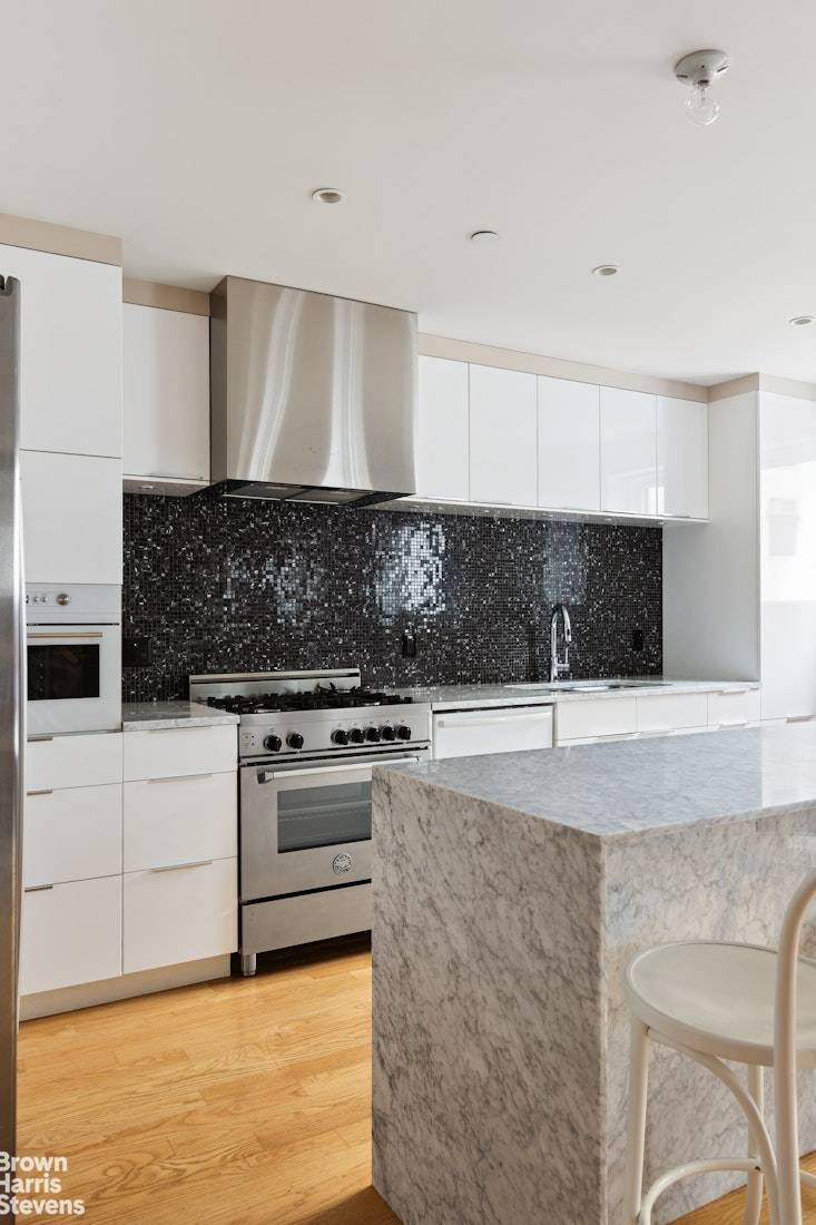 This meticulously renovated Tribeca loft seamlessly blends the iconic character of the neighborhood with contemporary luxury living.
