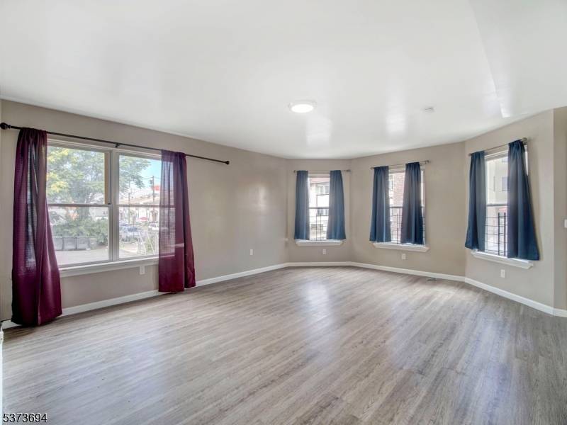 Welcome to this spacious and beautifully maintained three family home located in the heart of Paterson, New Jersey.