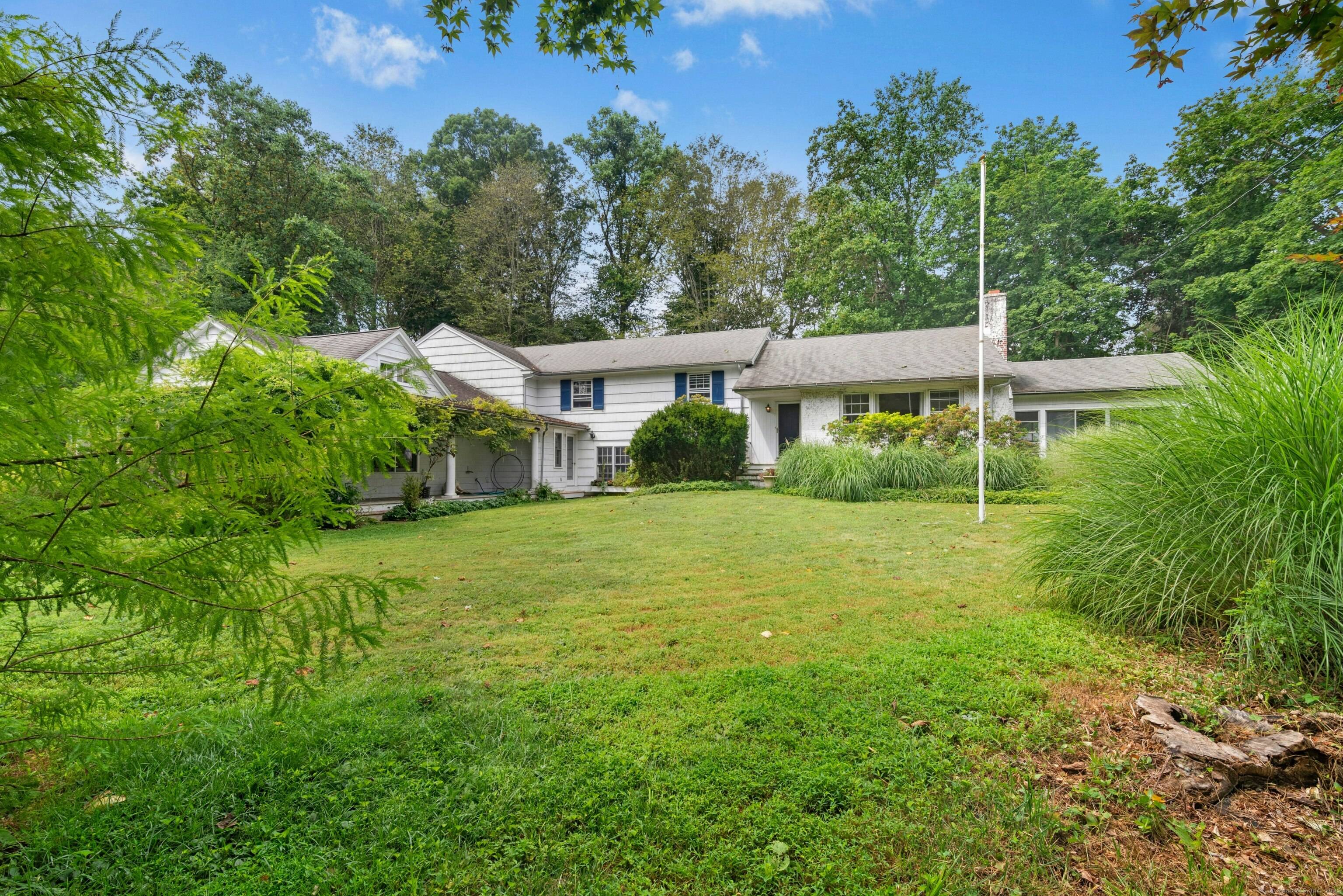 Set on a full acre in one of Darien's most sought after neighborhoods, this property presents a rare and versatile opportunity for visionary buyers.