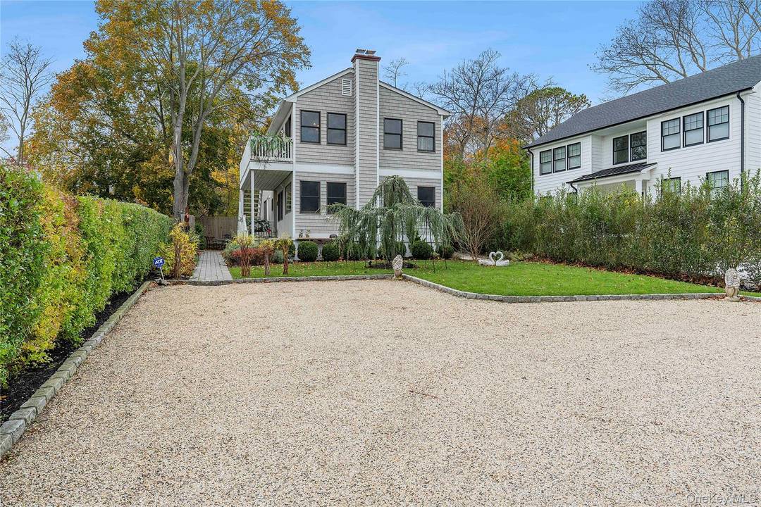 Tucked away on a quiet lane in East Quogue, this beautifully appointed multi level residence offers approximately 1, 700 square feet of refined Hamptons living.