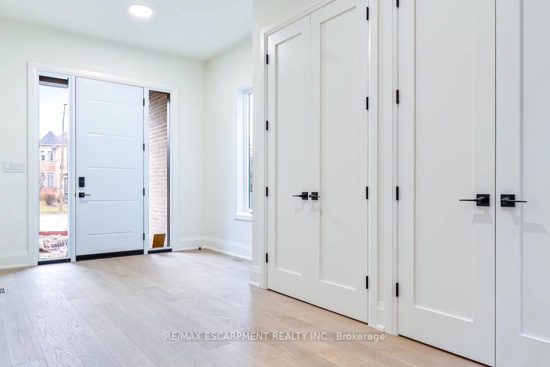 MOVE IN READY ! This brand new custom home is situated on a deep pool sized 170' deep lot, offering unparalleled backyard privacy in the heart of Oakville.