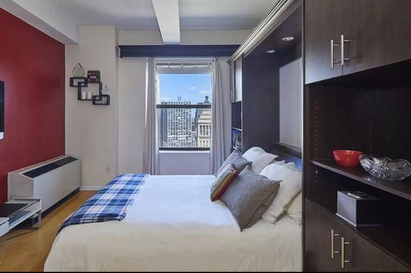 Live high in the sky with river and expansive city views in this light, bright furnished studio on the 41st floor of the Downtown Club.