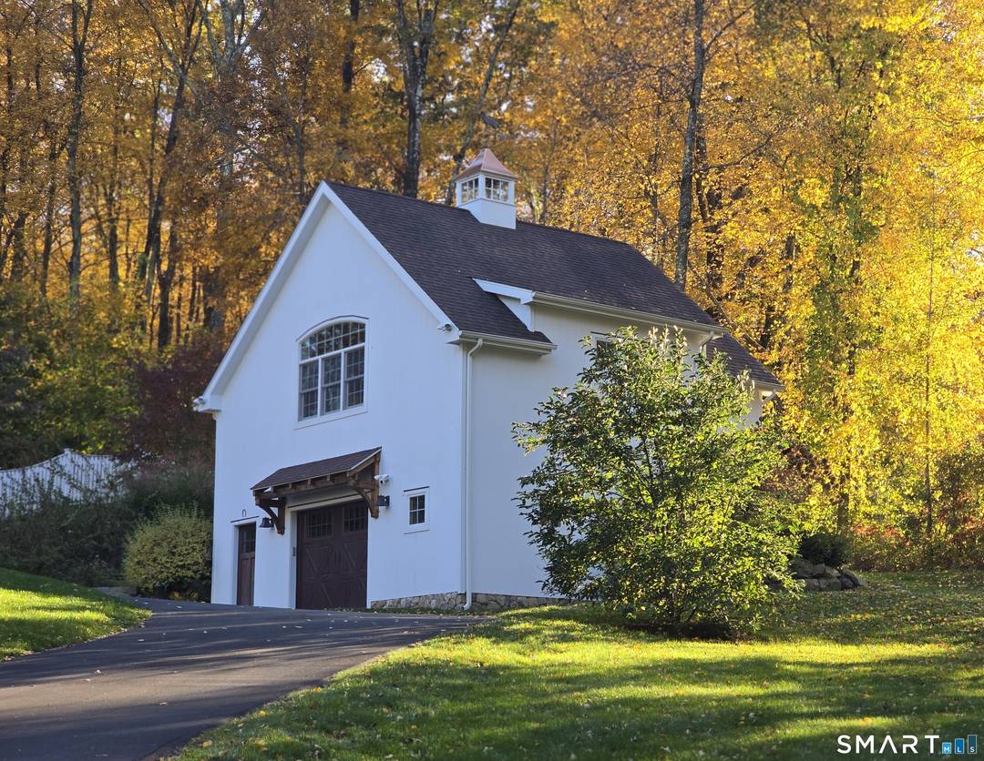 Nestled on three private acres in highly sought after Redding, Connecticut, and bordering Topstone Park, this exceptional property offers a lifestyle defined by tranquility, privacy, and space.