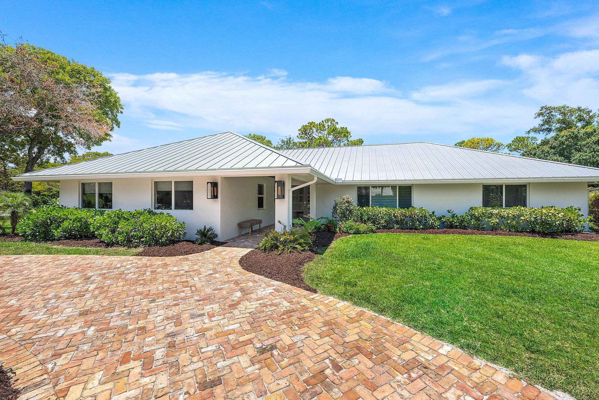 This fully renovated and exquisite home is located in the highly sought after Imperial Woods community in the heart of Jupiter, Florida.