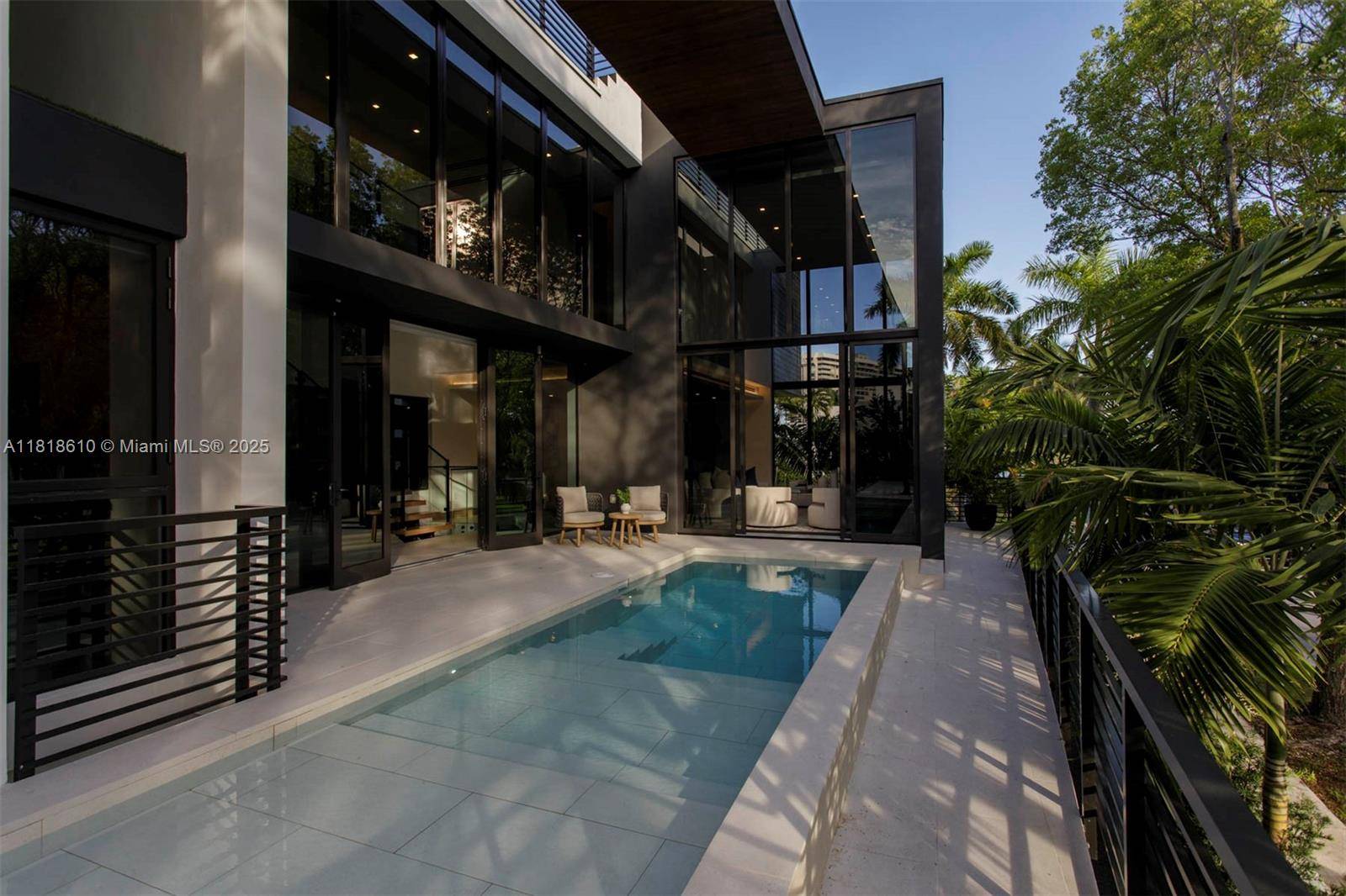 A new construction architectural gem on a corner lot in Coconut Grove s lush tropical enclave.