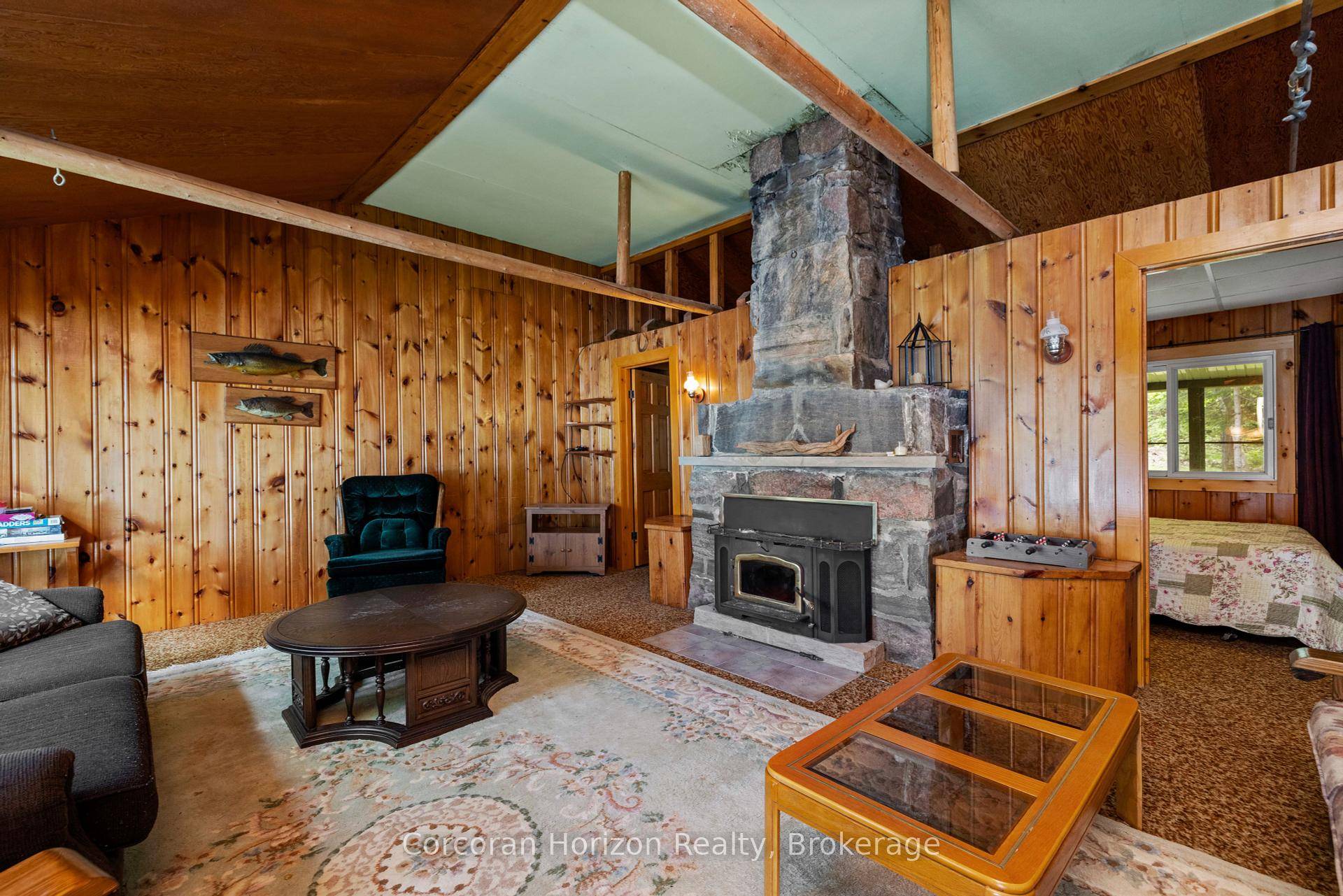 Welcome to 61 Arts Lane an exceptional waterfront retreat nestled on one of the most coveted stretches of Six Mile Lake.