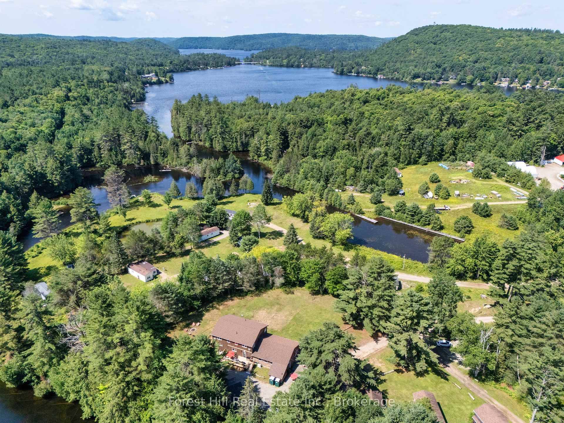 Exceptional residential and or commercial possibilies and opportunities abound on this unique, 10 acre waterfront property with 1, 200' on the Hollow River that has navigable boat access to MUSKOKA'S ...