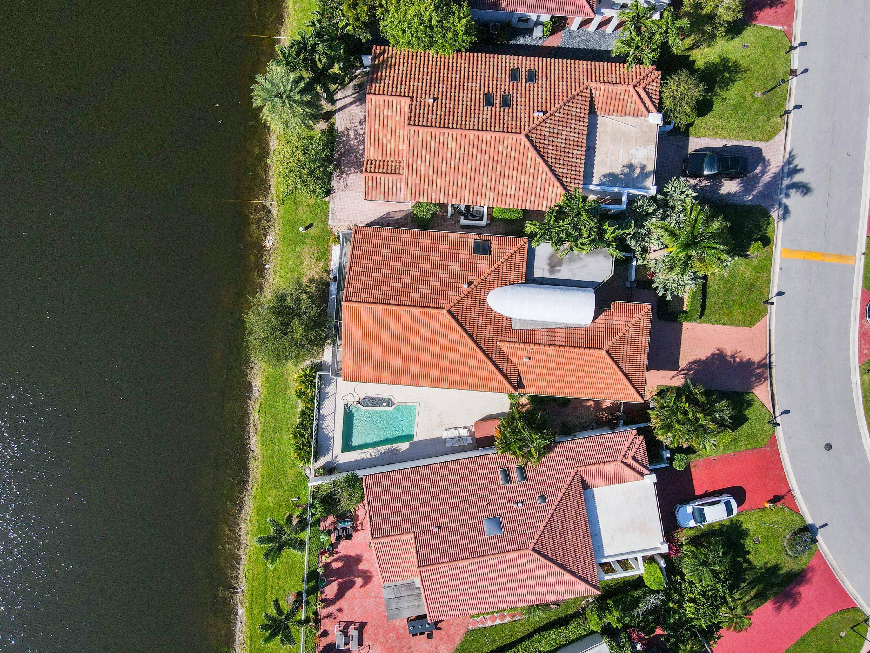 Embrace lakefront luxury in the sought after gated development, Newport Bay Club.