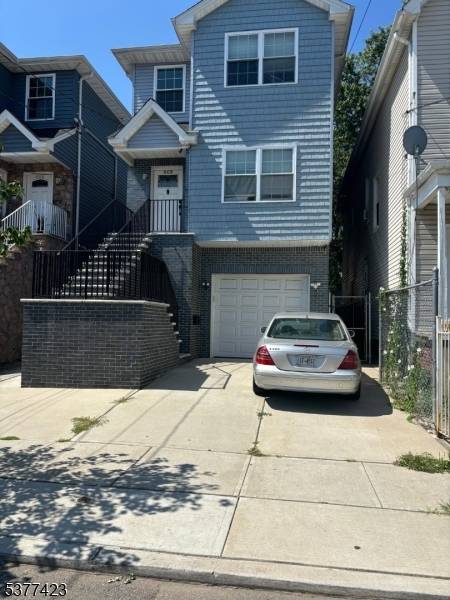 For sale is a newer Luxury Two Family Home.