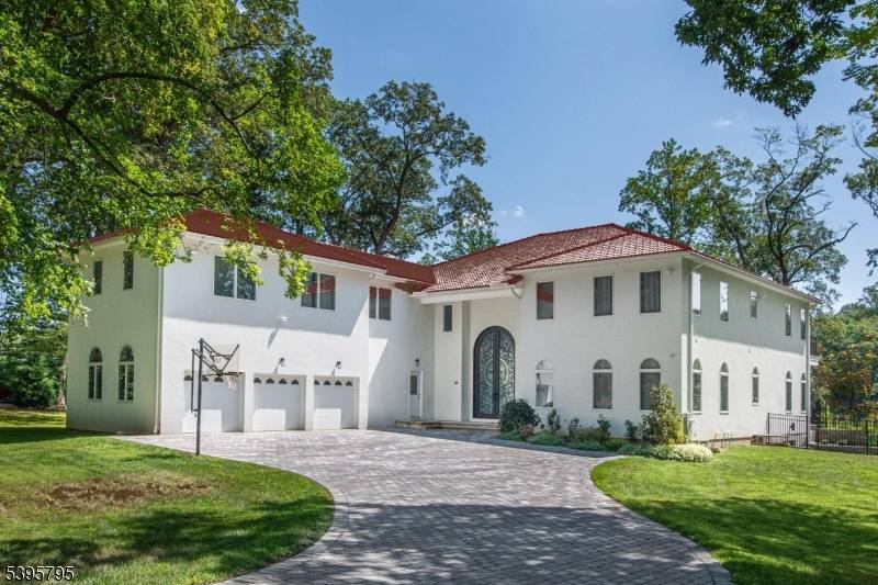 Step into this European inspired lakefront masterpiece, built in 2021 and set on a pristine 1.