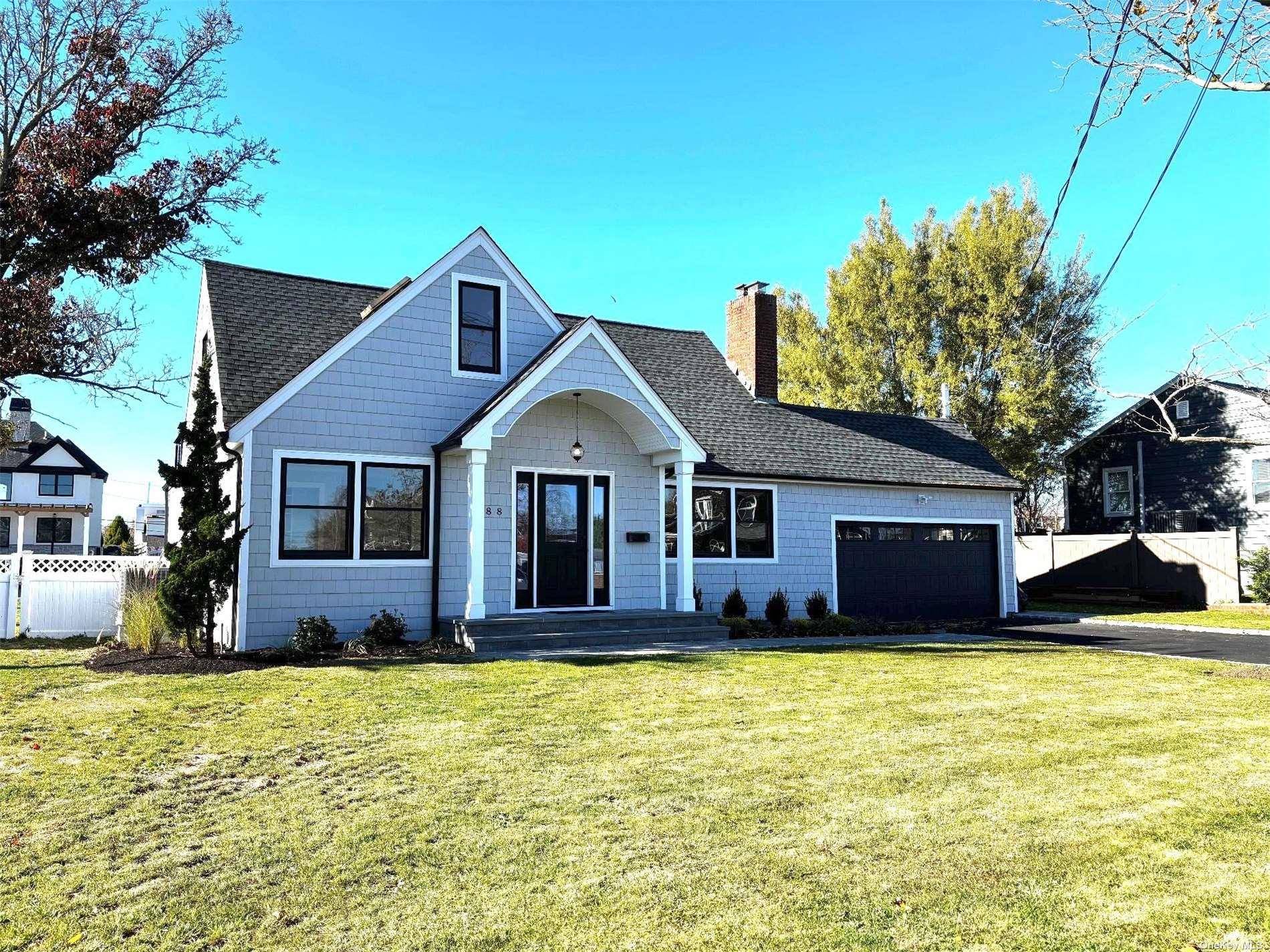 This beautifully renovated property offers a rare opportunity to enjoy modern coastal living just two minutes by boat from the Great South Bay.