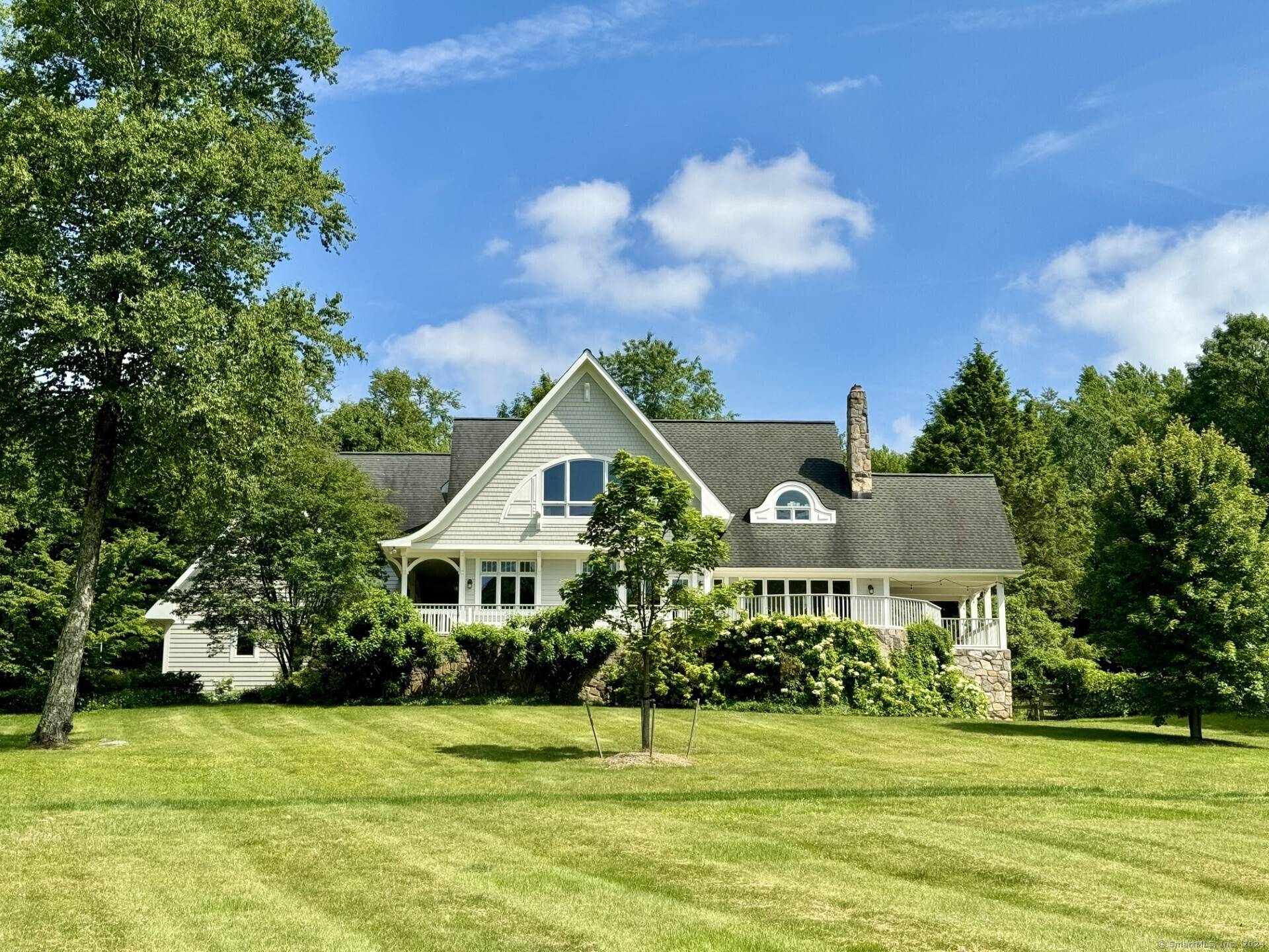 Private oasis in a coveted estate area with turn key residence, salt water pool and guest house.