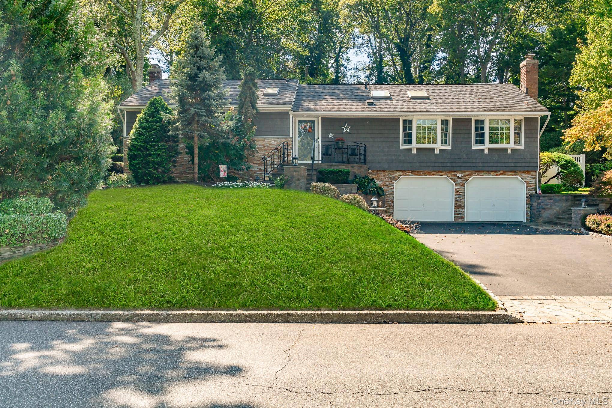 Welcome to this stunning, move in ready raised ranch perfectly positioned mid block on a truly picturesque street.