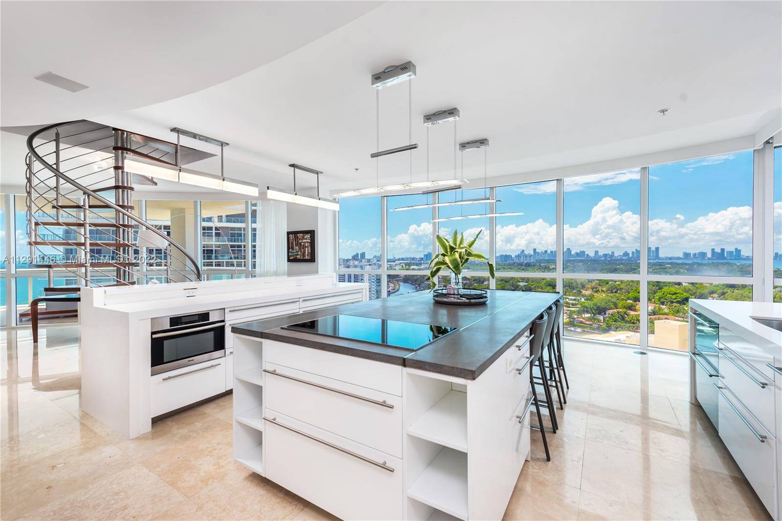 Impeccable corner 4 bedroom, 4 bathroom rare penthouse gem at the Mosaic in Miami Beach.