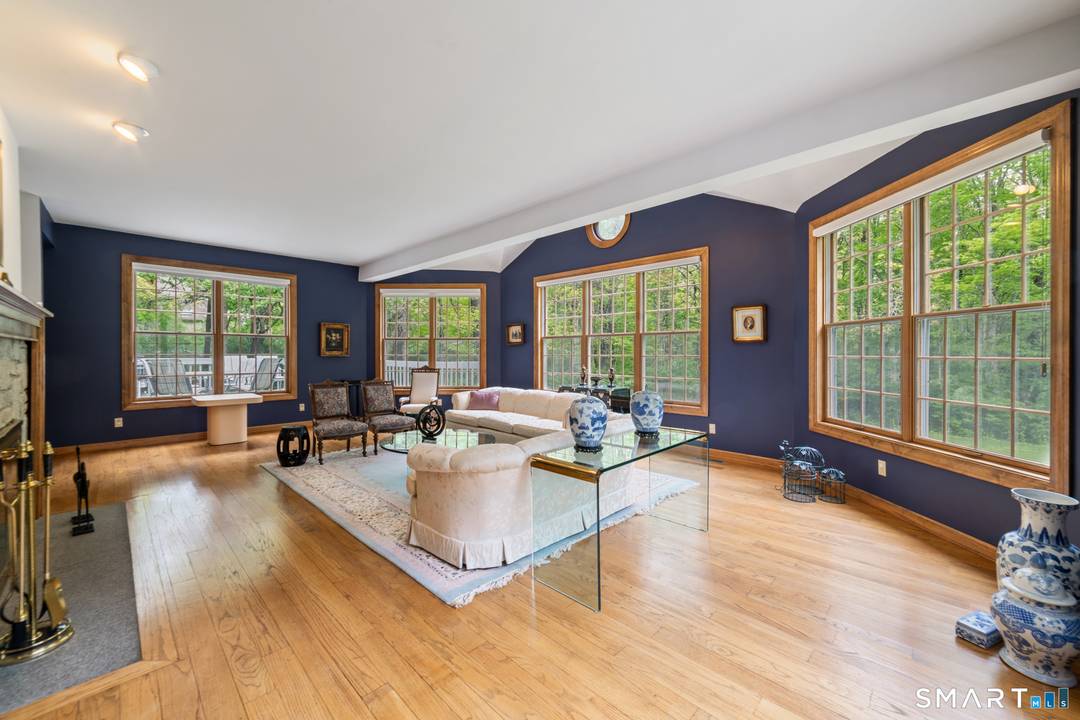 This colonial style home is situated in a desirable Southbury neighborhood, offering four bedrooms and two and a half bathrooms on a spacious, flat lot that borders a wildlife area.