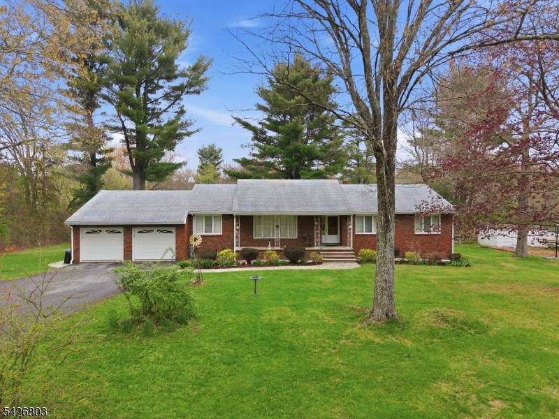 Experience the perfect blend of quality craftsmanship and untapped potential in this meticulously maintained custom built brick ranch.