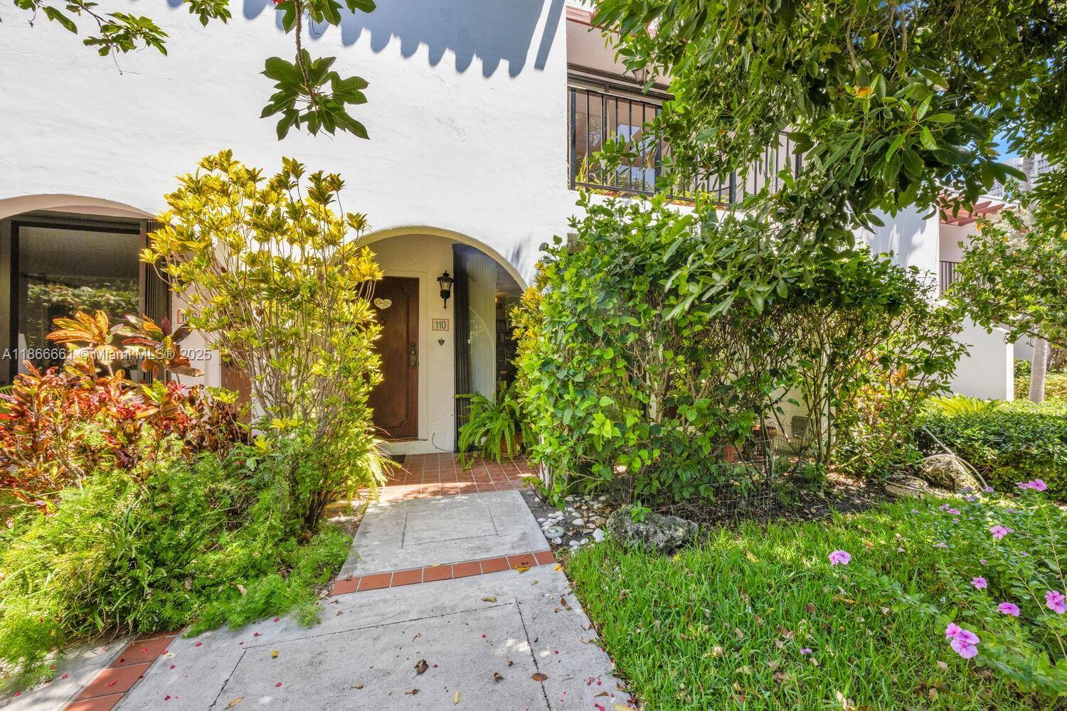 Spacious 2 Story 2 2. 5 garden townhouse with 1404 square feet in the desired Grapetree Community of Key Biscayne.