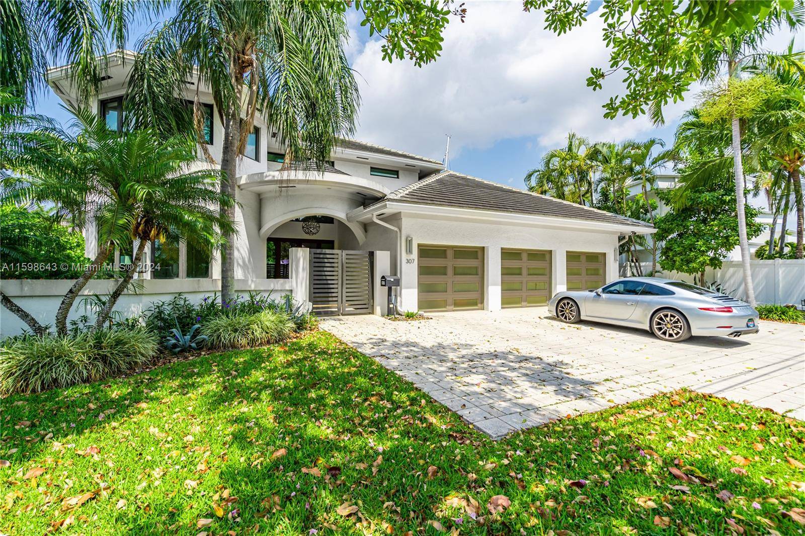 This exquisite smart home features a modern design with an open floor plan, high ceilings, loft area, Control4 automation, large island in kitchen with natural gas, seamless access to the ...