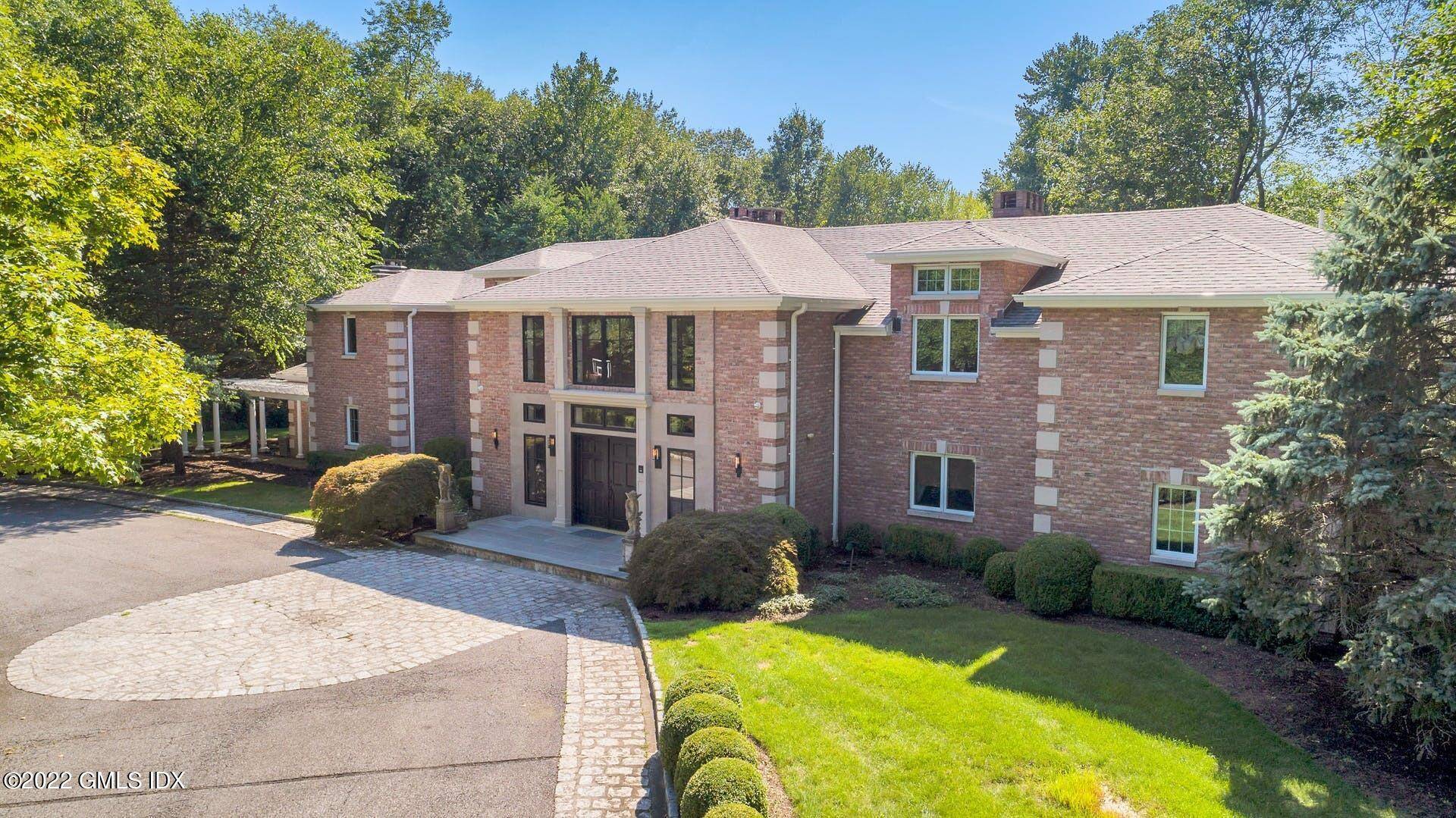 Exquisite brick estate on quiet 4 acres.