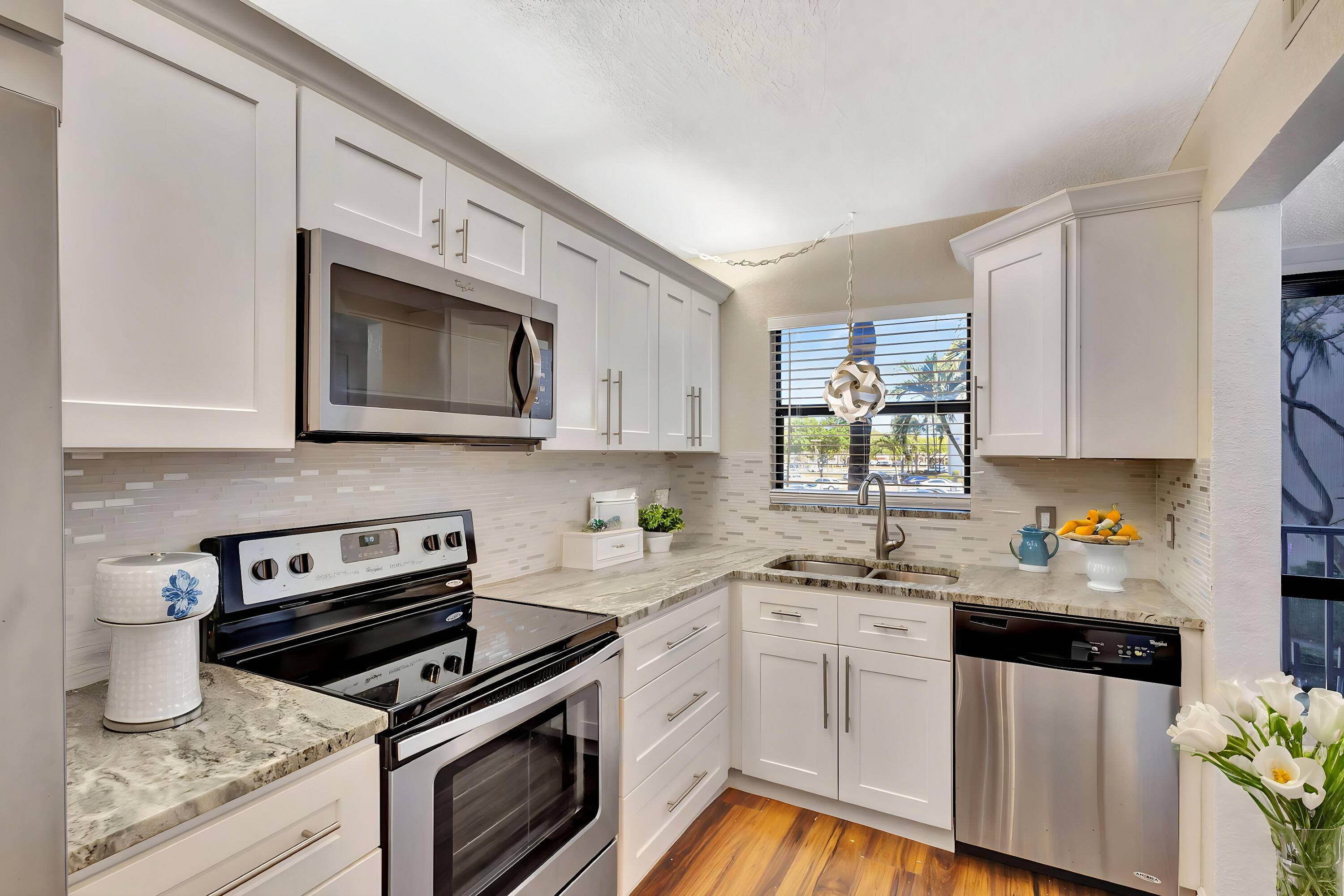 This beautifully remodeled 2BR, 2BA condo 55 Community offers a stylish living space with freshly painted walls, a brand new dishwasher, laminate wood floors, stainless steel appliances, white shaker wood ...