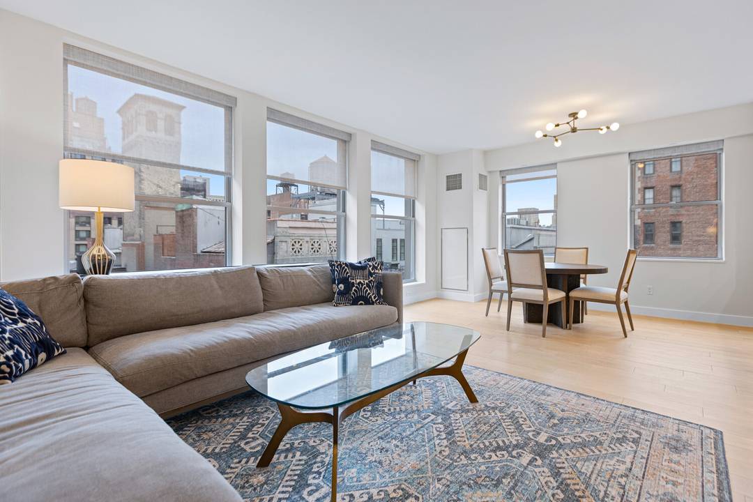 Perched on the 12th floor of a boutique Flatiron condominium, this immaculately renovated 2 bedroom, 2 bath residence offers three sunny exposures, a private keyed elevator entrance and central A ...