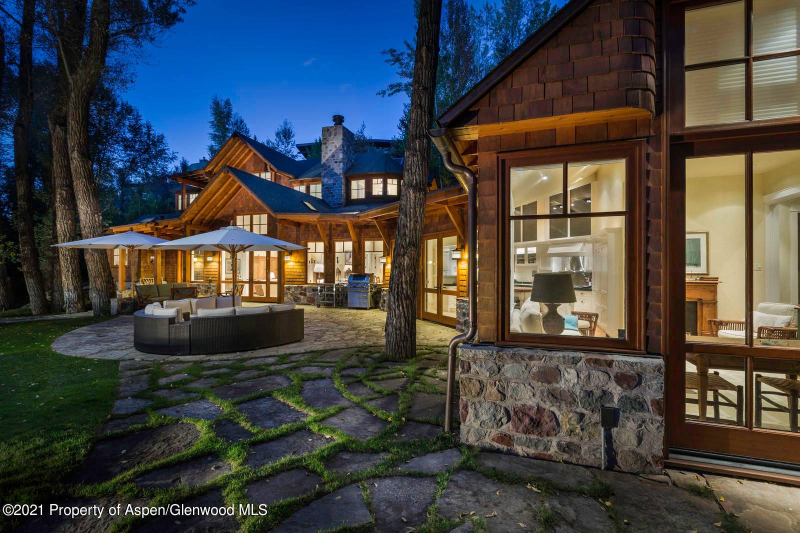 A short walk to a pedestrian bridge connects this private family compound to the John Denver Park, the Rio Grande Trail and all of downtown Aspen.
