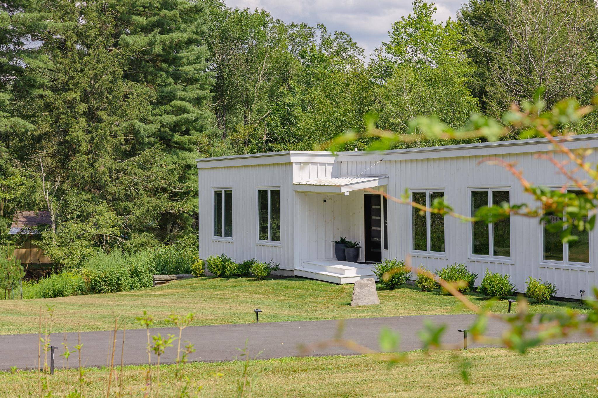 Tucked along a sleepy country road, surrounded by old farms and open skies, this modern makeover brings a bold twist to a classic home.