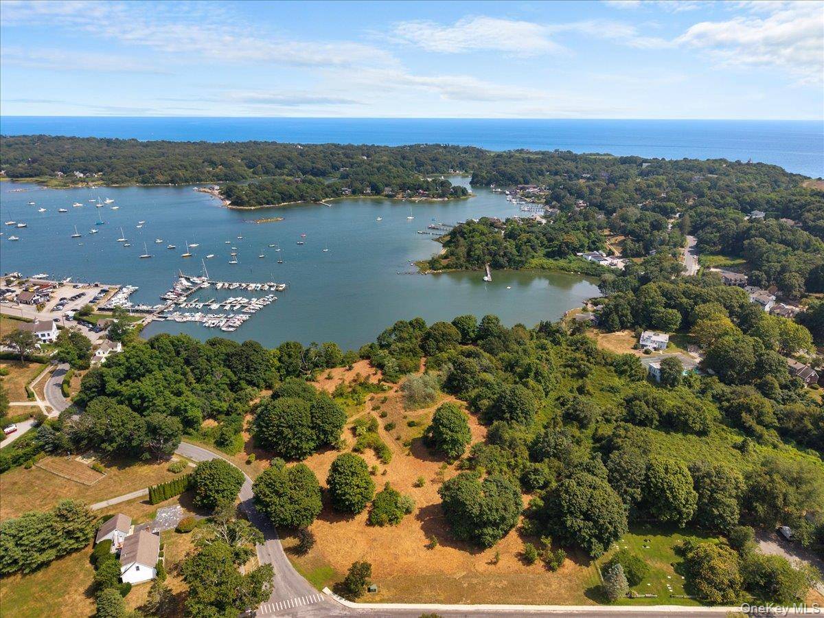 A uniquely expansive 7. 12 acre waterfront property, partially wooded, on West Harbor.