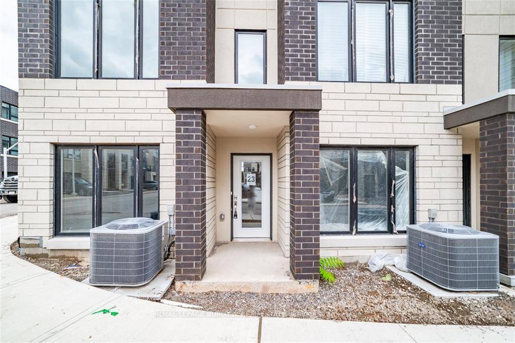 Modern living meets unbeatable location in this stunning 3 bed, 3 bath end unit townhouse in Burlington's highly sought after Station West community !