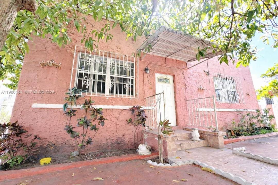 Welcome to this charming vintage residence, offering timeless character and solid concrete construction.