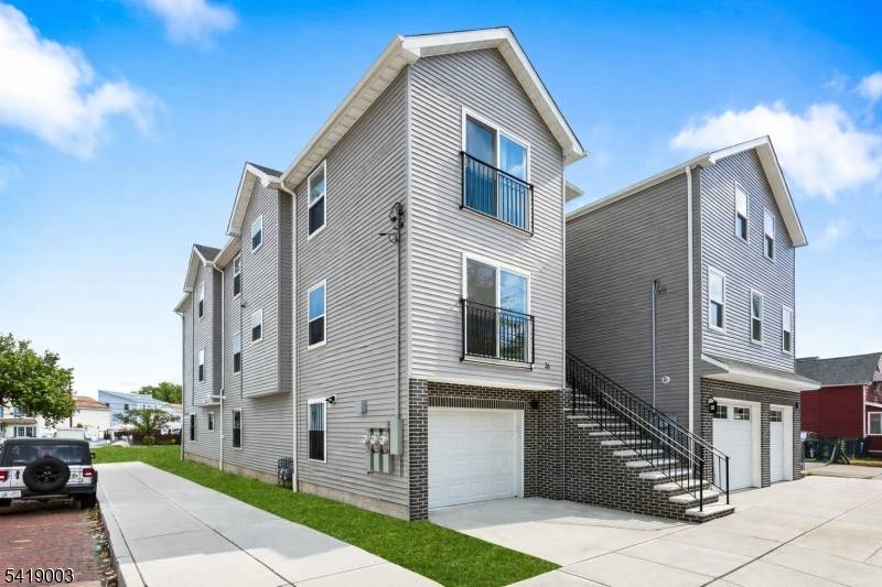 Beautiful newly built two family home offering modern design and comfortable living.