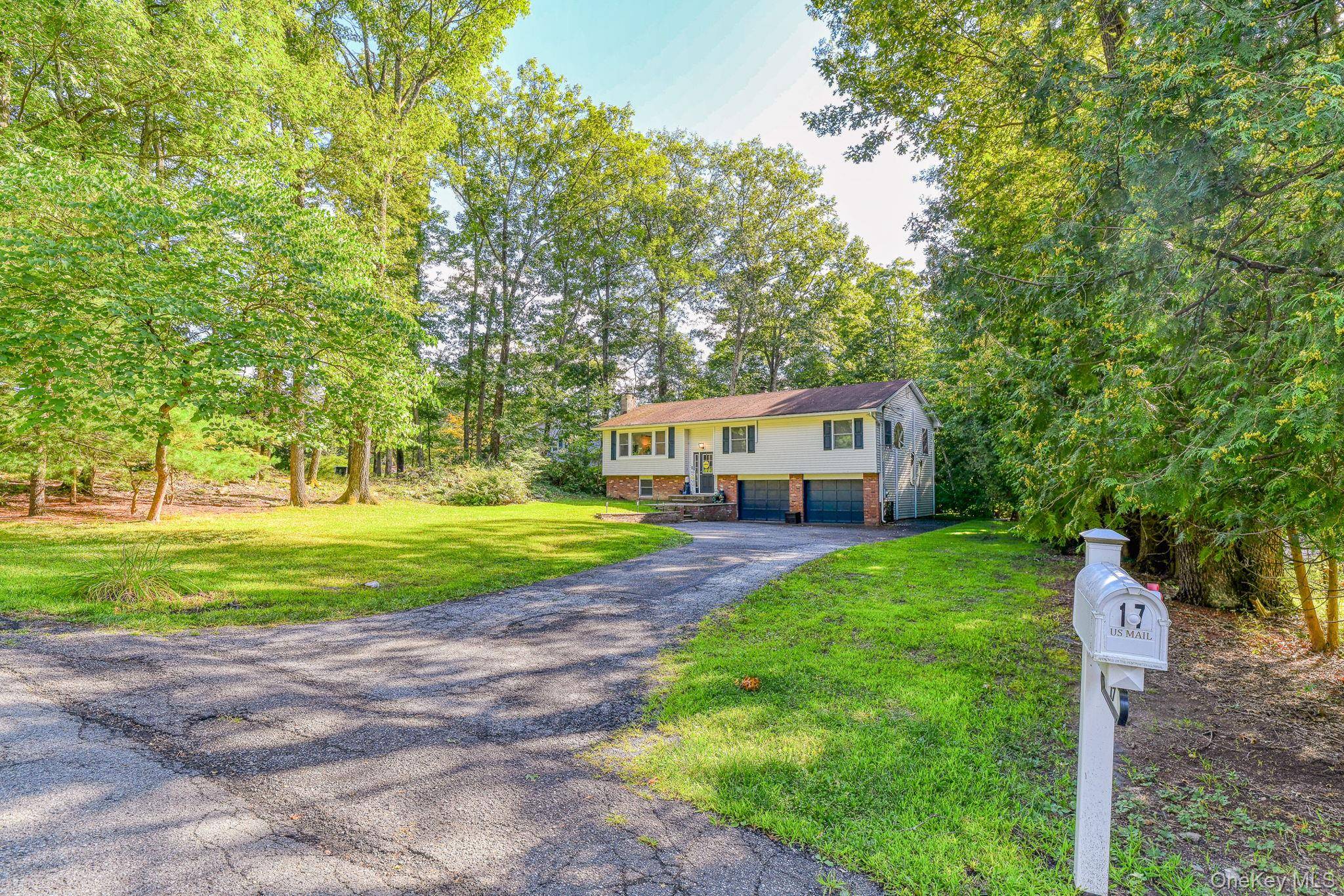 Welcome to 17 Pine Court, a beautifully renovated raised ranch set on a private corner lot in the heart of Wallkill.