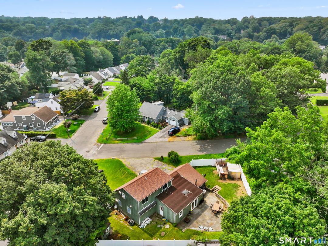 Welcome home to this warm and inviting 3 bedroom, 3 bath residence in Stamford's desirable Ridgeway neighborhood.
