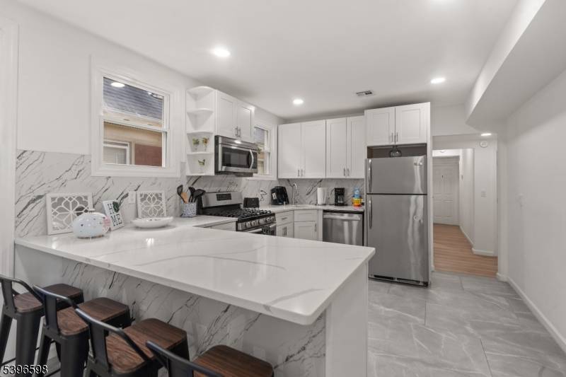 Welcome to this beautifully renovated and meticulously maintained two family home, perfect for owner occupants or investors !