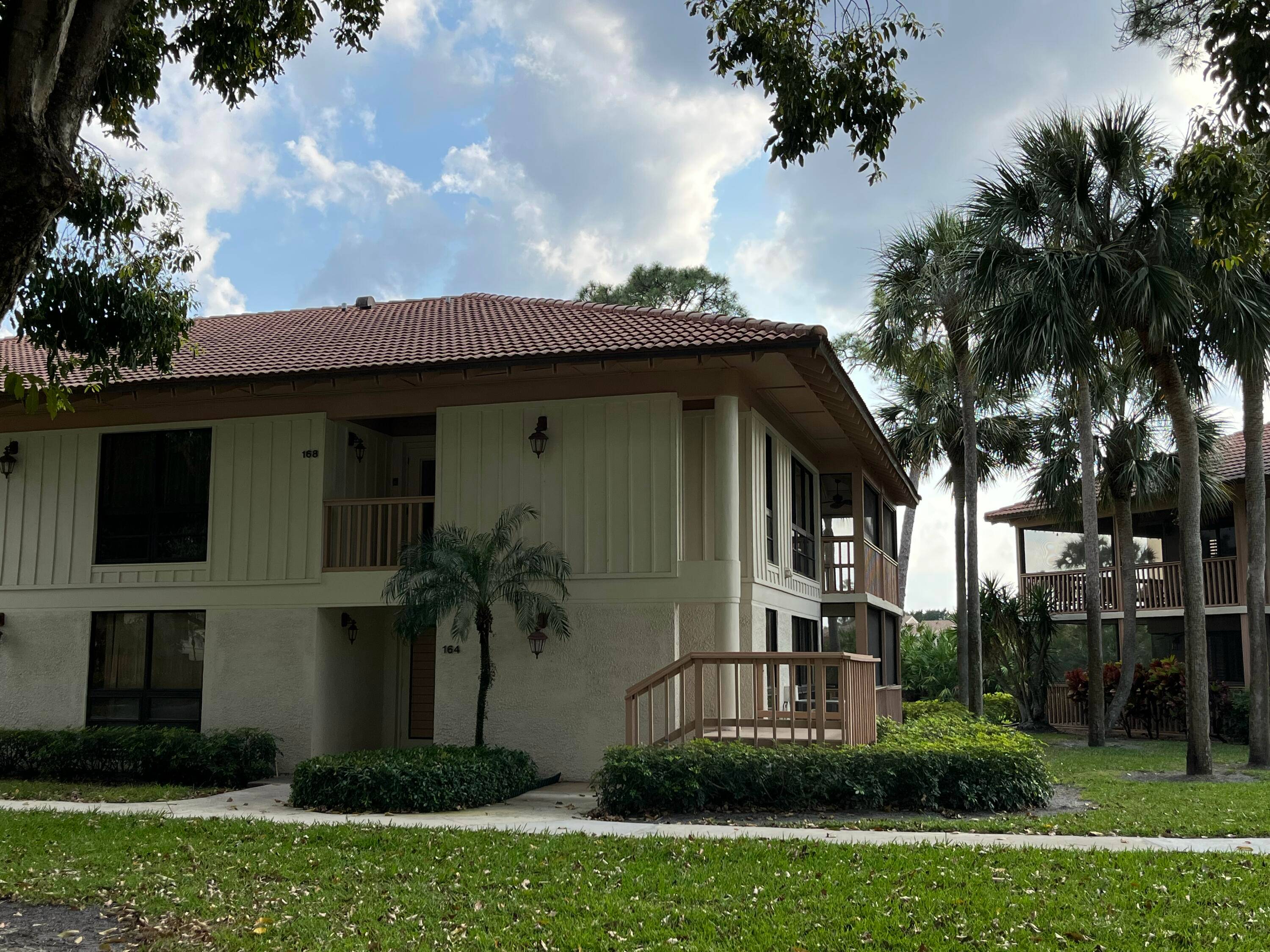 Wonderfully Bright and open second floor condo, with sweeping views of the 2nd hole of the championship golf course at PGA National.