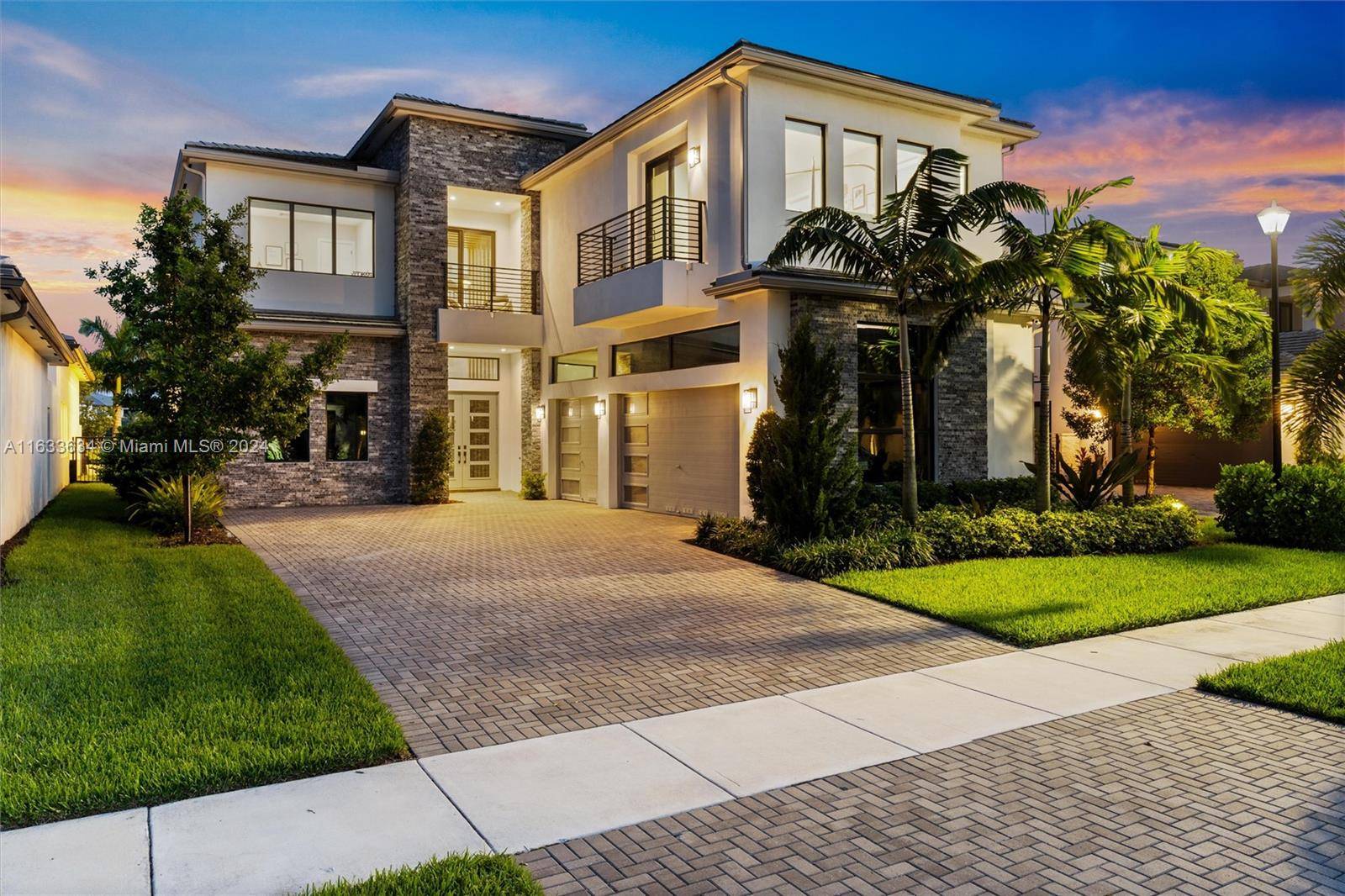 Experience unparalleled luxury in this exquisite south facing waterfront home, situated within the family oriented community of Boca Bridges.
