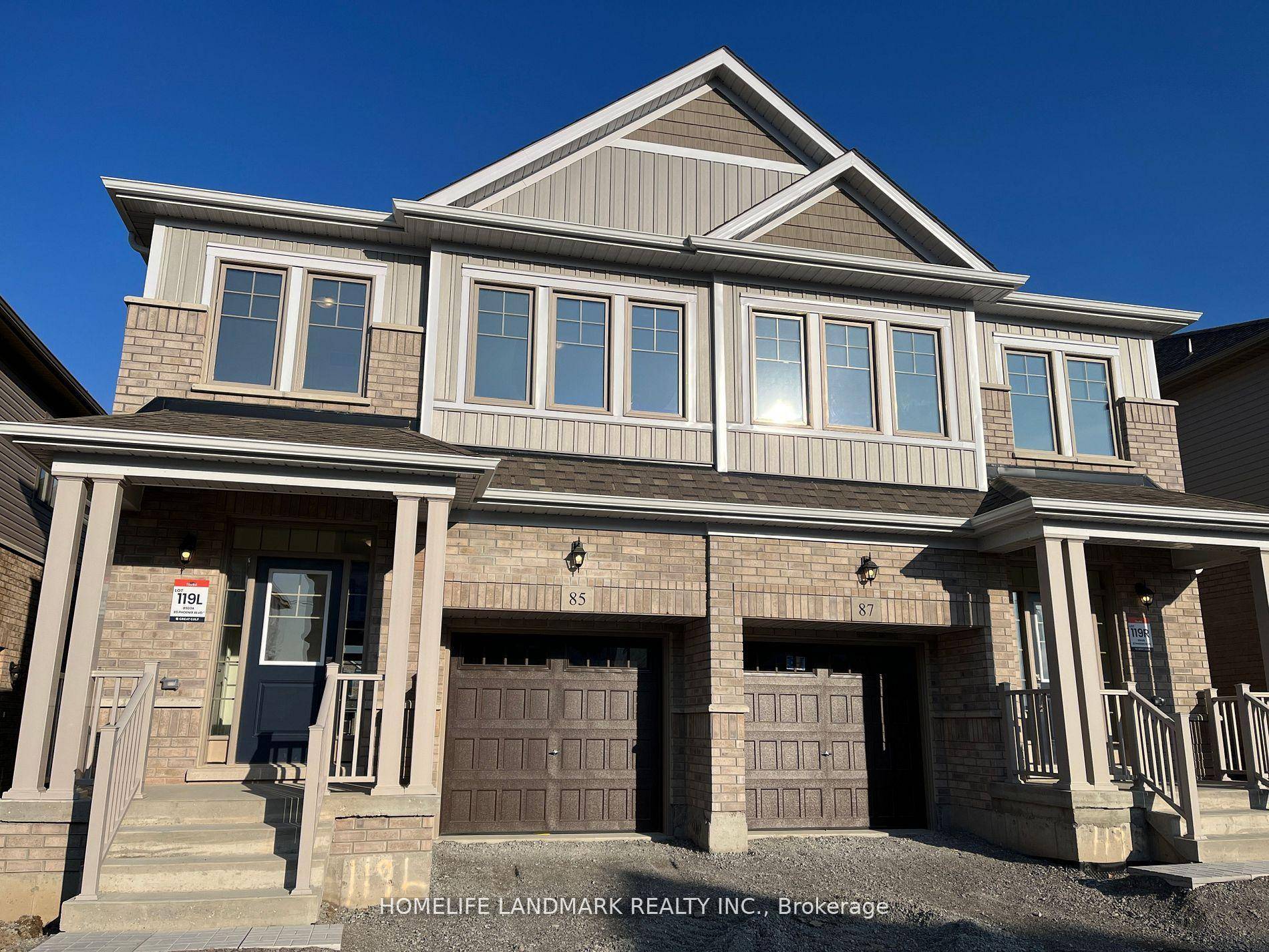 Open Concept modern Kitchen with stainless steel appliances, and large center island with stone countertops.