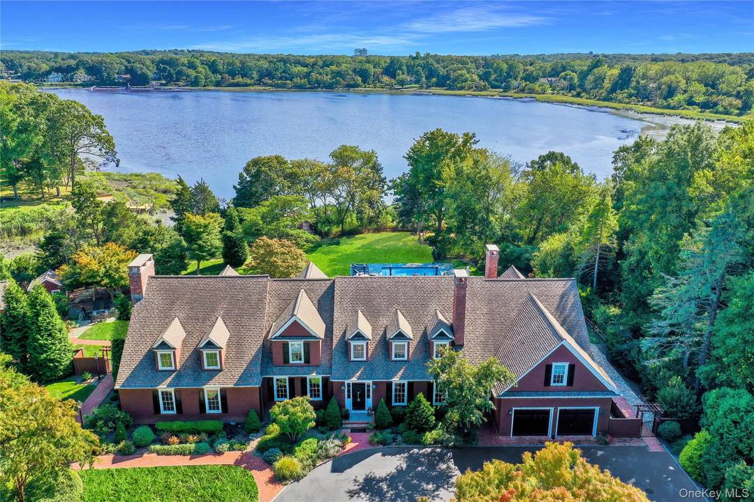 Magnificent Country Waterfront Estate on shy 3 acres tucked away in Strong's Neck, Setauket.