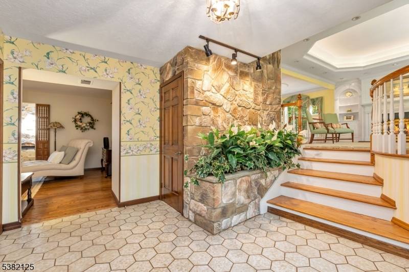 Poised on 2. 24 wooded open acres in Warren's coveted Red Hill neighborhood, this expanded 3, 000 SF Split Level Colonial unfolds with a seamless blend of grace and architectural ...